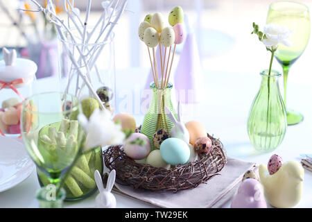 Beautiful Easter table setting on blurred background Stock Photo