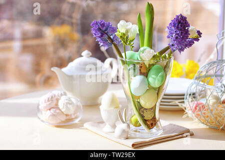 Beautiful Easter pastel decorations with table setting on blurred background Stock Photo