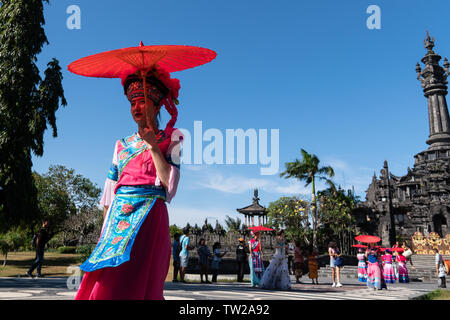 DENPASAR/BALI-JUNE 15 2019: The dancers from Yunan-China, wearing colorful costume, were walking after their performance at the opening of the Bali Ar Stock Photo