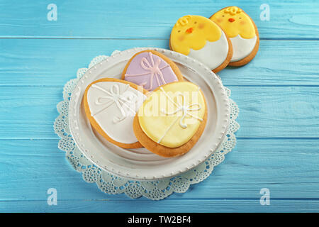 Beautiful glazed Easter cookies on wooden table Stock Photo