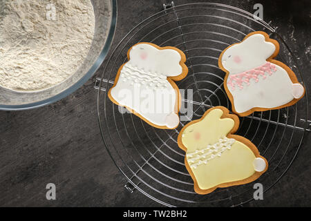 Beautiful glazed Easter cookies on cooling rack Stock Photo
