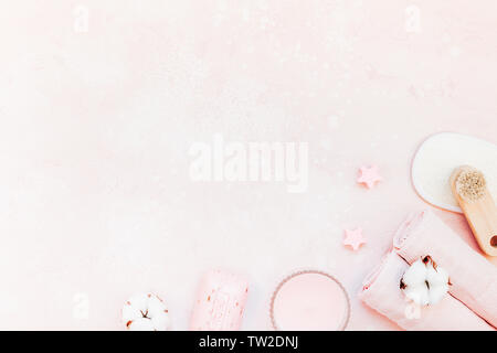 Spa, beauty cosmetics and body care treatment concept with copy space. Creative top view flat lay composition with bath accessories and rose soap cott Stock Photo