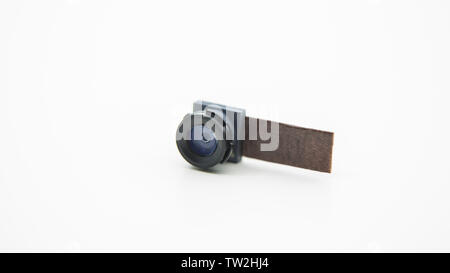 Close up on a camera module for mobile phone. Closeup of Smartphone Lens in studio picture with white background Stock Photo