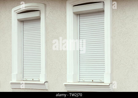 Plastic windows with roller shutters Stock Photo