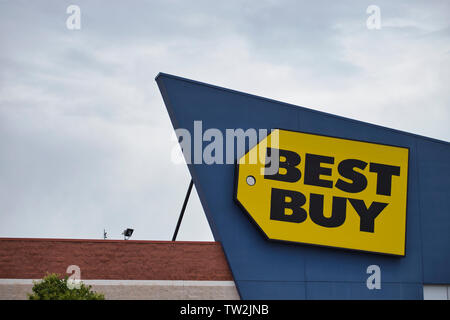 Storefront sign with some sky and clouds. June 2019. Southern Indiana Stock Photo