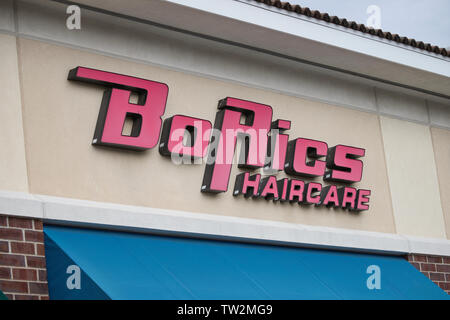 Storefront sign with some sky and clouds. June 2019. Southern Indiana. BoRics Haircare Stock Photo