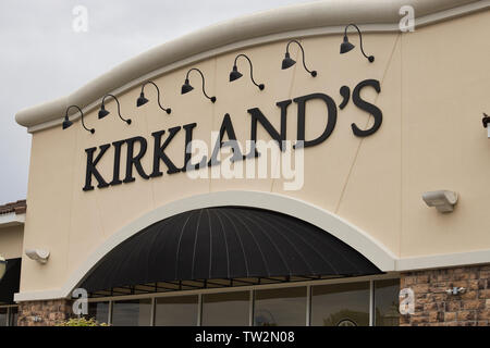 Storefront sign with some sky and clouds. June 2019. Southern Indiana Kirklands Stock Photo