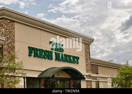 Storefront sign with some sky and clouds. June 2019. Southern Indiana - Fresh Market Stock Photo