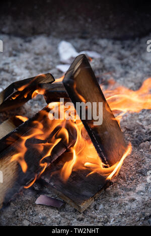 fire burnig small wood boards burning in a grill Stock Photo