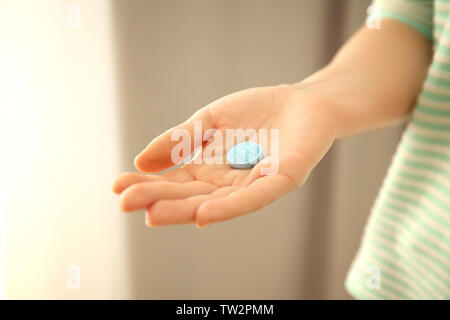 Female hand with rat poison on blurred background Stock Photo