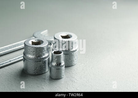 Hand sockets and spanners on light background Stock Photo