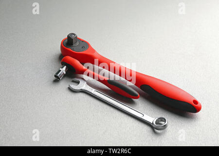 Ratchets and combination wrench on light background Stock Photo