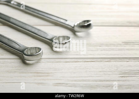 Ring spanners on wooden background Stock Photo