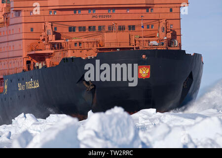 Aerial view of world's largest nuclear icebreaker, 50 years of Victory, an Arktika class vessel, en route to North Pole taking tourists to 90 degrees. Stock Photo