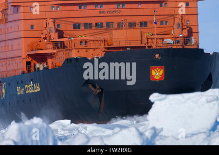 Aerial view of world's largest nuclear icebreaker, 50 years of Victory, an Arktika class vessel, en route to North Pole taking tourists to 90 degrees. Stock Photo