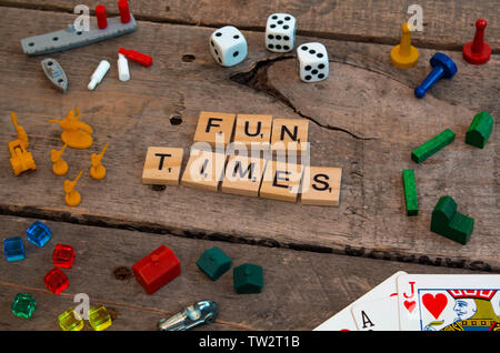 'Fun Times' made from Scrabble game letters, Risk, Battleship pieces, Monopoly, Settler of Catan and other game pieces Stock Photo