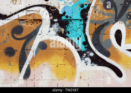 Urban abstract colorful background, shabby wall with fragment of graffiti Stock Photo