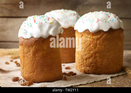 Delicious Easter cakes with raisins on wooden background Stock Photo
