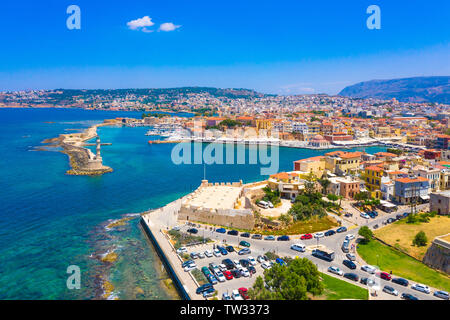 Panorama of the beautiful old harbor of Chania with the amazing lighthouse, mosque, venetian shipyards, Crete, Greece. Stock Photo