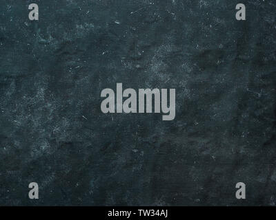 Dark mottled rustic background. Black blue canvas backdrop for design. Natural linen colored black blue dirty canvas fabric background or texture. Stock Photo