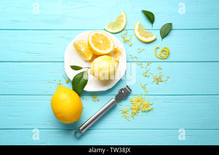 Composition with lemons and zest on wooden background Stock Photo