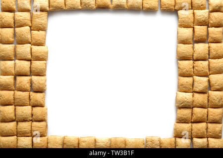 Frame of corn pillows on white background Stock Photo