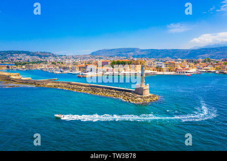 Panorama of the beautiful old harbor of Chania with the amazing lighthouse, mosque, venetian shipyards, Crete, Greece. Stock Photo