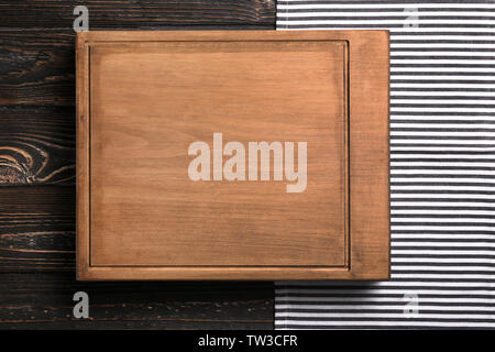 Rectangular cutting board on wooden table Stock Photo