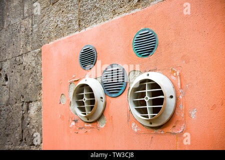 Venting on colored plaster wall with copy space Stock Photo