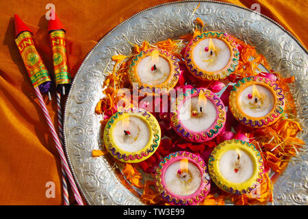 Close up of oil lamps with fire crackers Stock Photo