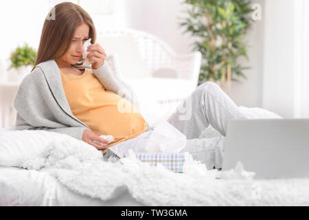 Young Pregnant Woman With Laptop Crying At Home Because Of Mood Change ...