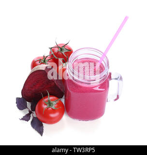 Mason jar with fresh vegetable juice an d ingredients on white background Stock Photo