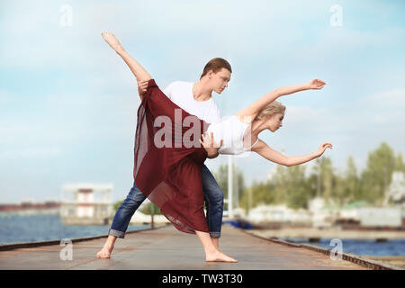 Passionate couple dancing outdoors Stock Photo