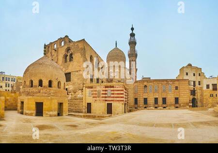Panorama of Amir Khayrbak complex with preserved residence, ornate stone mosque, madrasa and ablution fountain, Cairo, Egypt Stock Photo