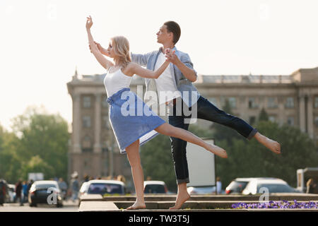 Passionate couple dancing outdoors Stock Photo