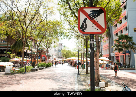 Do not feed the pigeons signs in bugis Waterloo Street. Stock Photo