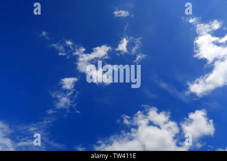Thick strands of cloud in a blue sky Stock Photo