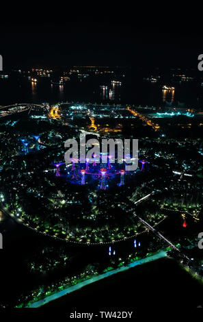 Aerial view taken at night time  from Marina Bay hotel looking down towards Gardens by the Bay Singapore. Stock Photo