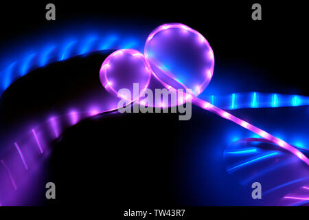 Abstract background of pink and blue neon lights in motion. Stock Photo