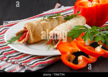 Sushi-Style Wraps with chicken pepperoni, vegetables and nuts. Healthy snacks Stock Photo