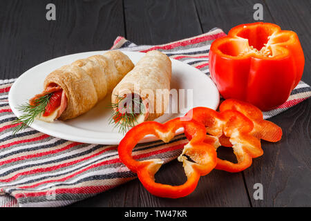 Sushi-Style Wraps with chicken pepperoni, vegetables and nuts. Healthy snacks Stock Photo