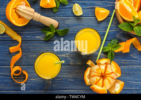 Composition with delicious orange juice on wooden table Stock Photo