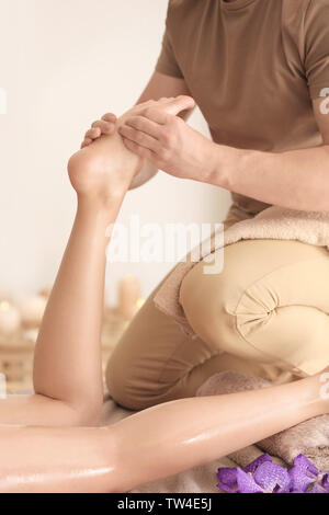Young woman having foot massage in spa salon Stock Photo