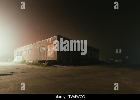old building in a foggy night. Stock Photo
