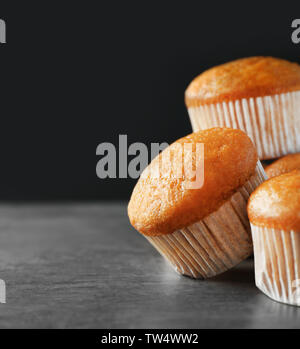 Delicious carrot muffins on dark background Stock Photo