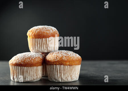 Delicious carrot muffins on dark background Stock Photo