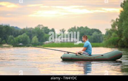 Inflatable rubber fishing boat on sandy beach near sea Stock Photo - Alamy