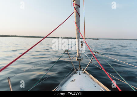 the nose of the yacht against the backdrop of the beautiful azure sea. Stock Photo