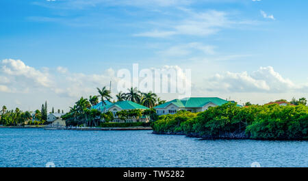 Grand Cayman, Cayman Islands, Jan 2019, houses by the Caribbean Sea in the residential area of Governor's Creek Stock Photo