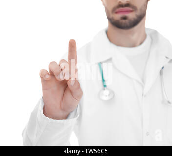 Young doctor using virtual screen, on white background Stock Photo